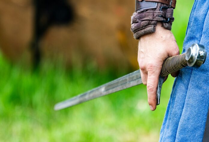 a person holding a knife in their hand